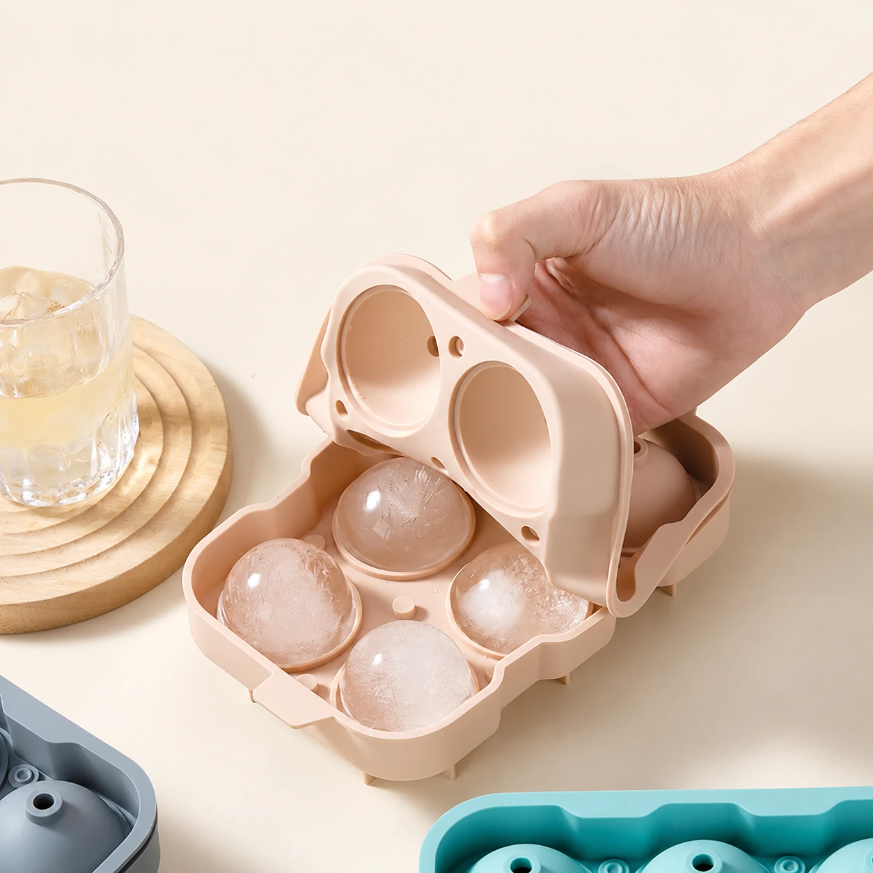 Lid opening on a pink sphere ice mould