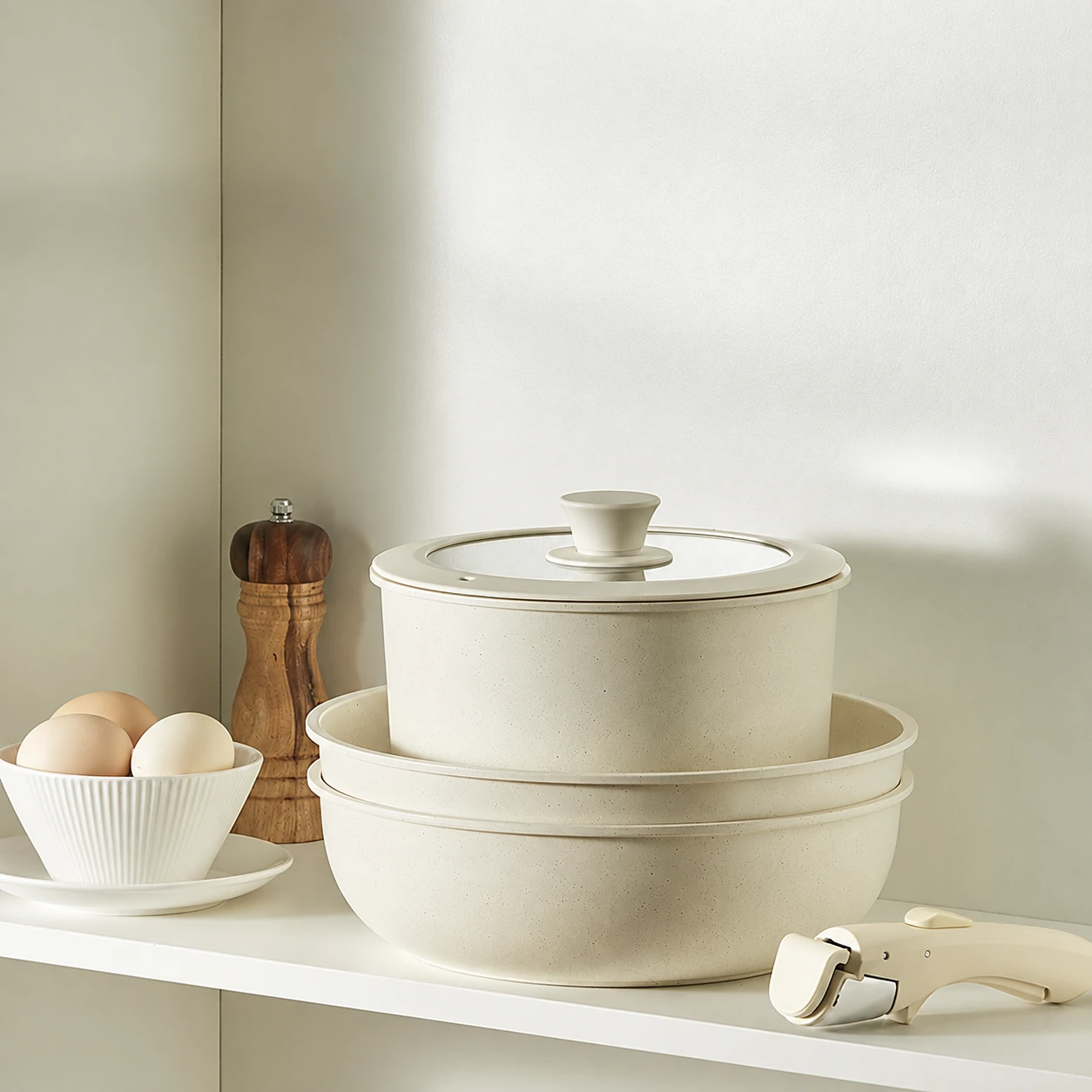 Ivory pots stacked with lids
