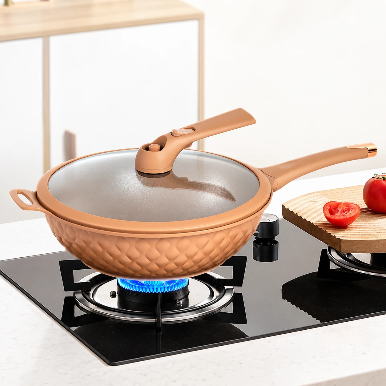 Terracotta-colour wok on a hob